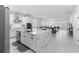 Well-lit kitchen with stainless steel appliances and an open concept to the living room at 4911 Shady Pines Dr, St Cloud, FL 34772