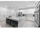 Contemporary kitchen with quartz countertops, an oversized island, and stainless steel appliances at 4911 Shady Pines Dr, St Cloud, FL 34772