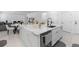Bright kitchen island with modern sink and faucet with open layout to living and dining area at 4911 Shady Pines Dr, St Cloud, FL 34772