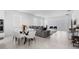 Open-concept living room featuring modern decor, a plush sectional sofa, and ample natural light at 4911 Shady Pines Dr, St Cloud, FL 34772