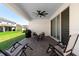 Covered patio with outdoor seating, a ceiling fan, and sliding glass doors at 4911 Shady Pines Dr, St Cloud, FL 34772