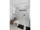 Modern bathroom featuring a glass shower with white herringbone tile and matte black hardware at 4911 Shady Pines Dr, St Cloud, FL 34772