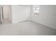 Bright bedroom with bi-fold closet doors and window at 5027 Sw 165Th Street Rd, Ocala, FL 34473