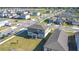 Aerial view of a gray home in a neighborhood on a sunny day at 5251 Meredrew Ln, St Cloud, FL 34771