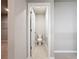 A powder room with a toilet and light colored walls and floors at 5251 Meredrew Ln, St Cloud, FL 34771