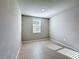 Minimalist bedroom featuring tiled flooring, recessed lighting and neutral paint throughout at 5251 Meredrew Ln, St Cloud, FL 34771