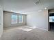 Spacious carpeted bedroom featuring natural light from windows at 5251 Meredrew Ln, St Cloud, FL 34771