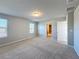 Spacious bedroom features neutral walls, carpet, and natural light through two windows at 5251 Meredrew Ln, St Cloud, FL 34771