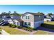 Well-maintained two-story home with a landscaped front yard and private driveway in a residential neighborhood at 5251 Meredrew Ln, St Cloud, FL 34771