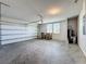 Functional two-car garage with window and painted walls offering storage at 5251 Meredrew Ln, St Cloud, FL 34771
