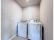Compact laundry area equipped with a Samsung washer and dryer at 5251 Meredrew Ln, St Cloud, FL 34771