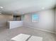 Spacious loft area with neutral carpet, modern lighting and natural light from the window at 5251 Meredrew Ln, St Cloud, FL 34771