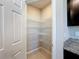 Walk-in pantry with multiple shelves for storage, conveniently located next to the kitchen at 5251 Meredrew Ln, St Cloud, FL 34771