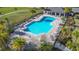 Overhead shot of the community pool and pavilion showcasing ample seating, lounge area, and manicured landscaping at 5251 Meredrew Ln, St Cloud, FL 34771