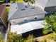 Aerial back exterior view of home, showing screened porch and backyard at 543 Flower Fields Ln, Orlando, FL 32824