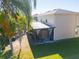 Aerial backyard showing trees, green lawn, and home's screen enclosed porch at 543 Flower Fields Ln, Orlando, FL 32824