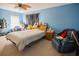 Bedroom featuring carpet, a window, and a ceiling fan, showcasing an inviting space at 543 Flower Fields Ln, Orlando, FL 32824