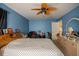 Bedroom featuring carpet, a window, and a ceiling fan, showcasing an inviting space at 543 Flower Fields Ln, Orlando, FL 32824