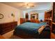 Comfortable bedroom with ceiling fan, neutral walls and traditional wood furniture at 543 Flower Fields Ln, Orlando, FL 32824