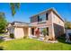 Home exterior with attached garage, landscaped front yard and mature shrubs at 543 Flower Fields Ln, Orlando, FL 32824