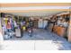 Spacious garage featuring ample storage, workbench, and motorcycle parking at 543 Flower Fields Ln, Orlando, FL 32824