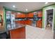 Large kitchen with granite countertops, stainless steel appliances, and tiled floor at 543 Flower Fields Ln, Orlando, FL 32824
