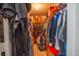 Walk-in closet with plenty of clothing racks and space for storage at 543 Flower Fields Ln, Orlando, FL 32824