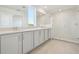 Modern bathroom featuring double vanity, granite countertops, and glass-enclosed shower at 5717 Haystack Dr, St Cloud, FL 34771