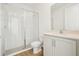 Modern bathroom featuring a glass shower, toilet, and vanity with granite countertop at 5717 Haystack Dr, St Cloud, FL 34771