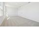 Bright bedroom with plush carpeting, fresh paint, and a large window for natural light at 5717 Haystack Dr, St Cloud, FL 34771