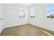 Bright bedroom with two windows and wood-look flooring offering lots of natural light at 5717 Haystack Dr, St Cloud, FL 34771