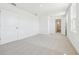 Spacious bedroom with neutral carpeting, fresh paint, and a walk in closet at 5717 Haystack Dr, St Cloud, FL 34771