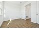 Bright bedroom with a window and wood-look flooring offering lots of natural light at 5717 Haystack Dr, St Cloud, FL 34771