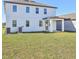 The house's backyard features a well-maintained lawn and a covered patio at 5717 Haystack Dr, St Cloud, FL 34771