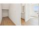 Hallway view showing a small storage area and a bathroom with a granite vanity at 5717 Haystack Dr, St Cloud, FL 34771