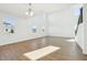 Bright living room featuring high ceilings, lots of windows, and wood-style flooring at 5717 Haystack Dr, St Cloud, FL 34771