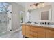Stylish bathroom with double vanity, marble countertop, and a glass-enclosed shower at 5824 N Dean Rd, Orlando, FL 32817