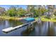 Picturesque waterfront home featuring a private boat dock, lift, and stunning lake views at 5824 N Dean Rd, Orlando, FL 32817
