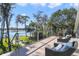 Relaxing outdoor deck with comfortable seating and scenic views of the lake and lush landscape at 5824 N Dean Rd, Orlando, FL 32817