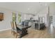 Elegant dining area adjacent to a modern kitchen, featuring a large table and contemporary design at 5824 N Dean Rd, Orlando, FL 32817
