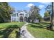 Lakefront home with a wall of windows, screened porch, outdoor stairway, and gorgeous view at 5824 N Dean Rd, Orlando, FL 32817