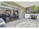 Attached Garage featuring outdoor kitchen, hot tub, and glass door access to the covered area at 5824 N Dean Rd, Orlando, FL 32817