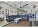 Spacious garage features a lounge area, sleek concrete floors, and glass garage doors for natural lighting at 5824 N Dean Rd, Orlando, FL 32817