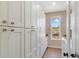 Well-organized laundry room with ample storage cabinets and a side-by-side washer and dryer at 5824 N Dean Rd, Orlando, FL 32817
