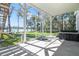 Inviting screened patio with a hot tub, stairs to backyard and scenic lake views at 5824 N Dean Rd, Orlando, FL 32817
