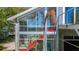 Sunroom with exterior view of palm tree and staircase at 5824 N Dean Rd, Orlando, FL 32817