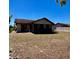 Spacious backyard showcasing a single-story home and a white privacy fence at 604 Tradewinds Dr, Deltona, FL 32738