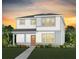 Charming two-story home with white siding and a well-manicured lawn and walkway at 7006 Rosy Sky Ave, Orlando, FL 32829