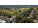 Stunning aerial view of a golf course community with lush green fairways and luxury townhomes at 7593 Gathering Dr # 203, Reunion, FL 34747