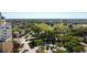 Picturesque aerial view of a golf course community with well-manicured lawns, residences, and lush landscaping at 7593 Gathering Dr # 203, Reunion, FL 34747